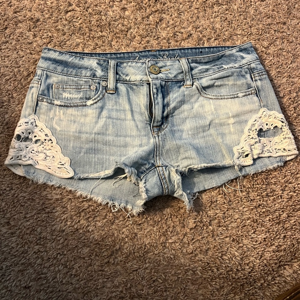 American Eagle denim shorts with lace trim size 4